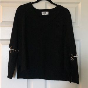 Sweater with grommet sleeve detailing